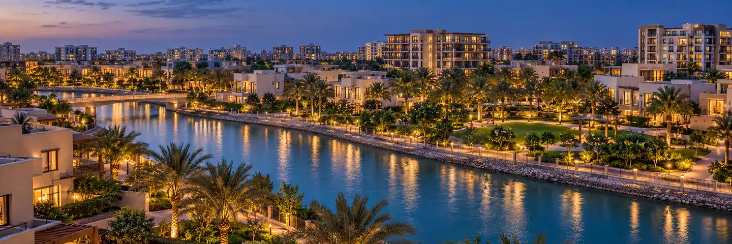 A leafy residential community in Dubai at dusk